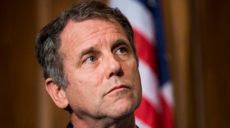 UNITED STATES - OCTOBER 9: Sen. Sherrod Brown, D-Ohio, listens as the Senate Veterans' Affairs Committee Democrats hold a news conference to highlight the impacts of the government shutdown on veterans on Wednesday, Oct. 9, 2013. (Photo By Bill Clark/CQ Roll Call)