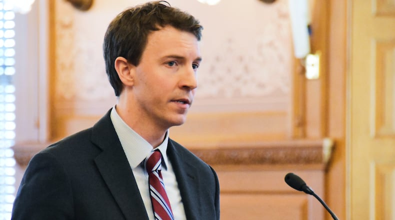 FILE - Bryan Seeley, a Major League Baseball senior vice president, testifies on a bill during a legislative committee hearing, March 13, 2018, at the Statehouse in Topeka, Kan. (AP Photo/Mitchell Willetts, File)