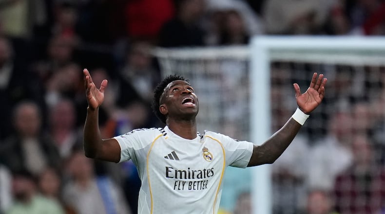 Real Madrid's Vinicius Junior celebrates after scoring his side's second goal during the second leg of the Champions League playoff soccer match between Real Madrid and Benfica in Madrid, Spain, Wednesday, Feb. 25, 2026. (AP Photo/Manu Fernandez)