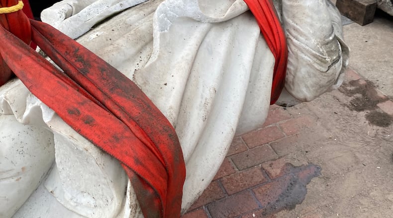 In this photo provided by Nino Mangione, a statue of Christopher Columbus is pulled out of the Inner Harbor in Baltimore, July 6, 2020, after protesters had thrown the statue into the harbor. (Nino Mangione via AP)