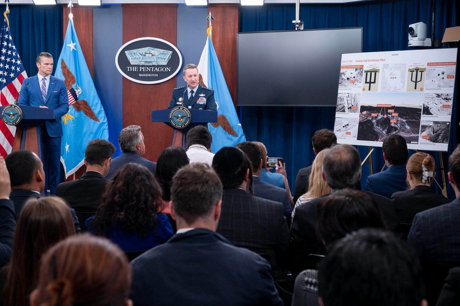 Joint Chiefs Chairman Gen. Dan Caine, right, speaks during a news conference with Defense Secretary Pete Hegseth at the Pentagon, Thursday, June 26, 2025 in Washington. (AP Photo/Kevin Wolf)