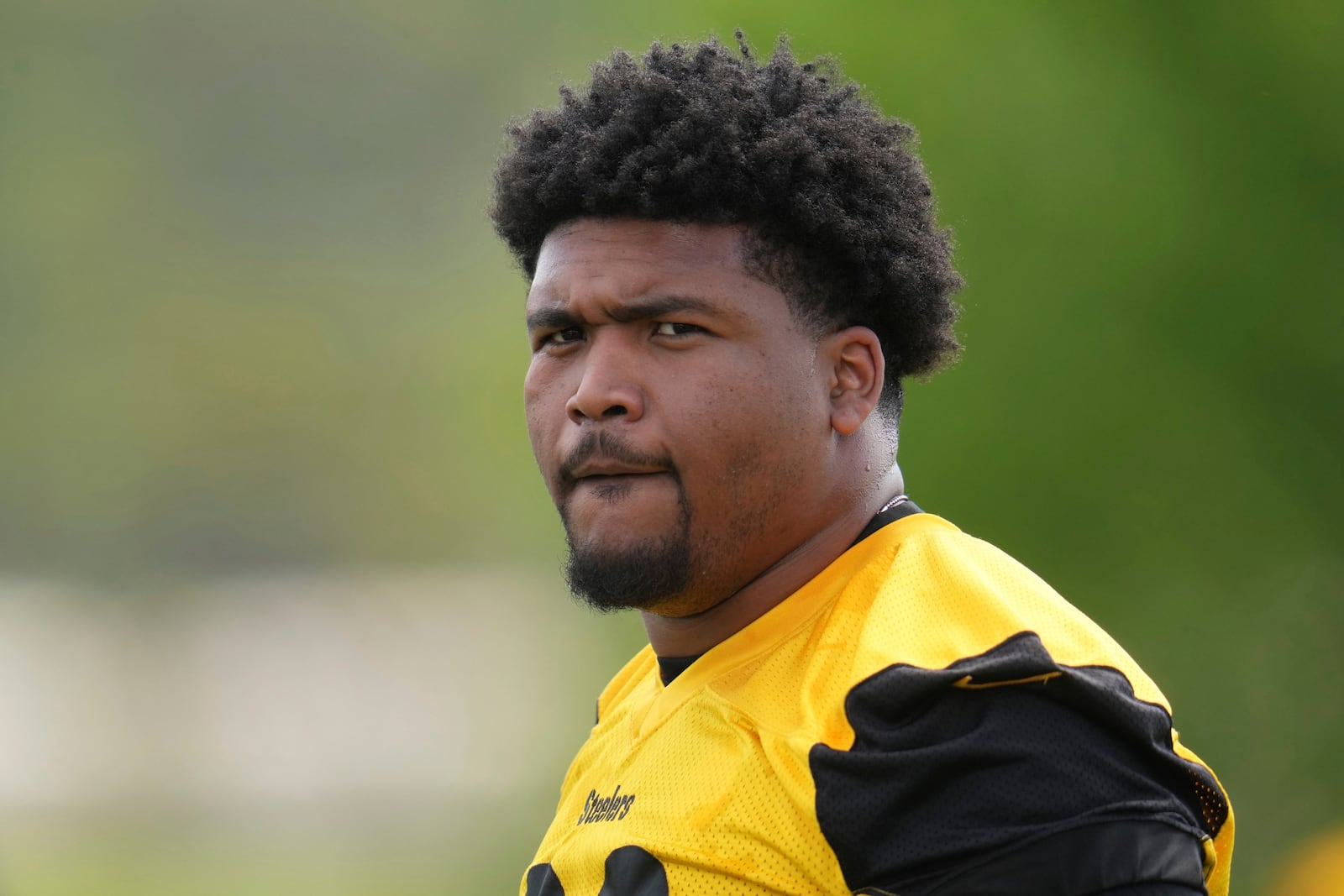 Pittsburgh Steelers first round draft pick Derrick Harmon (99) looks on during the during the NFL football team's rookie camp in Pittsburgh, Friday, May 9, 2025. (AP Photo/Gene J. Puskar)