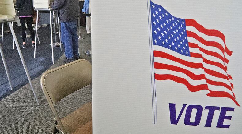 Voters casting their votes during early voting at the Clark County Board of Elections during November's election. Bethel Twp., is looking at putting its police levy back on the ballot in May. BILL LACKEY/STAFF