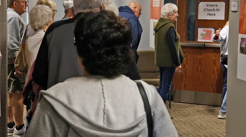 A line of people wait to check-in and vote at the election poll in the First Christian Church Tuesday, Nov. 7, 2023. BILL LACKEY/STAFF