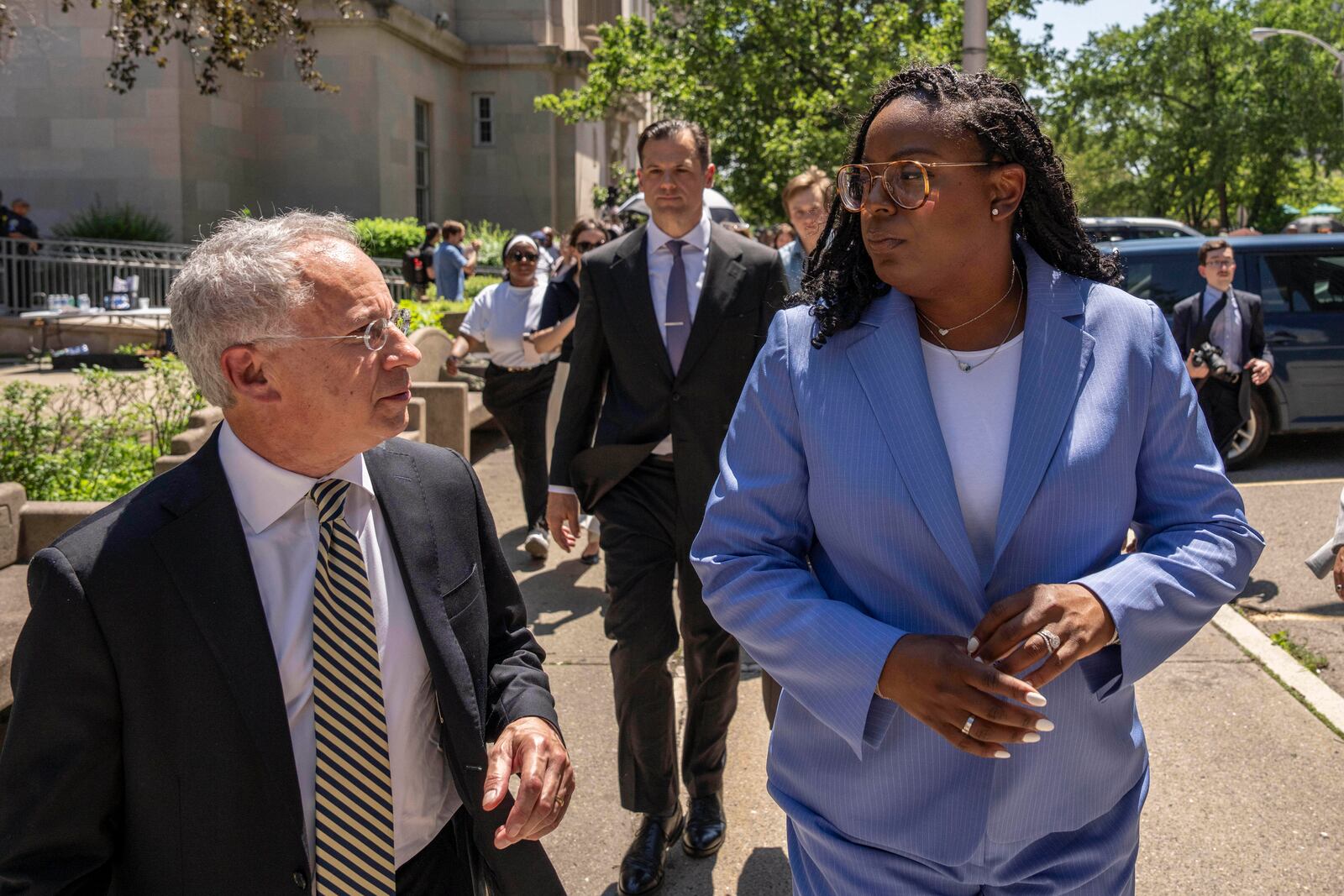 Rep. LaMonica Mclver, right, (D-10th) and attorney Paul Fishman, left, leave a press conference outside a federal court Wednesday, June 25, 2025, in Newark, N.J. (AP Photo/Yuki Iwamura)
