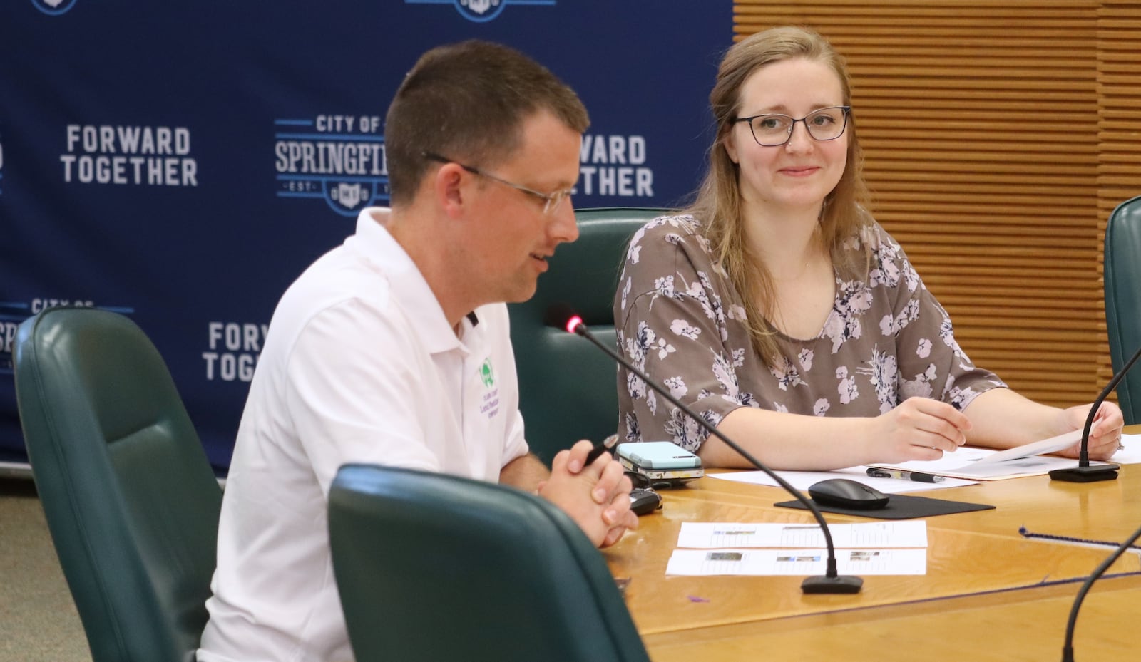 Kara Van Zant, development project manager of the Clark County Land Reutilization Corporation, listens as Director Ethan Harris speaks about upcoming land bank projects Tuesday, June 3, 2025 at City Hall. JESSICA OROZCO/STAFF