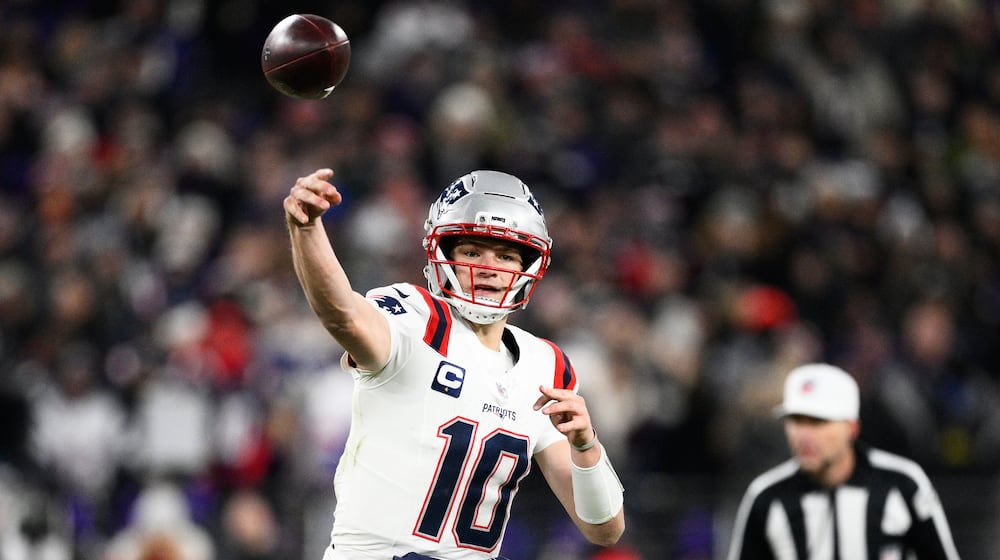 New England Patriots quarterback Drake Maye (10) passes against the Baltimore Ravens during the first half of an NFL football game, Sunday, Dec. 21, 2025, in Baltimore. (AP Photo/Nick Wass)