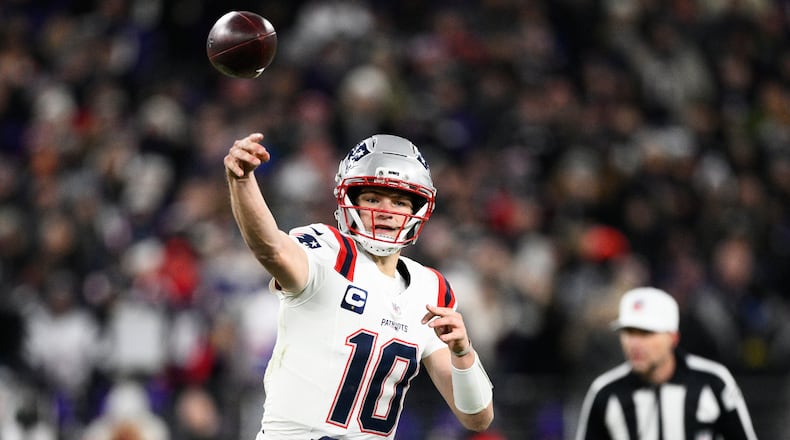 New England Patriots quarterback Drake Maye (10) passes against the Baltimore Ravens during the first half of an NFL football game, Sunday, Dec. 21, 2025, in Baltimore. (AP Photo/Nick Wass)