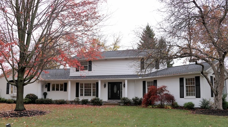 The 3,900-square-foot, brick-and-frame two-story at 1015 Hillcrest Drive is on a corner lot with a mature tree-line that wraps the back and side yard for added privacy. Contributed photos by Kathy Tyler