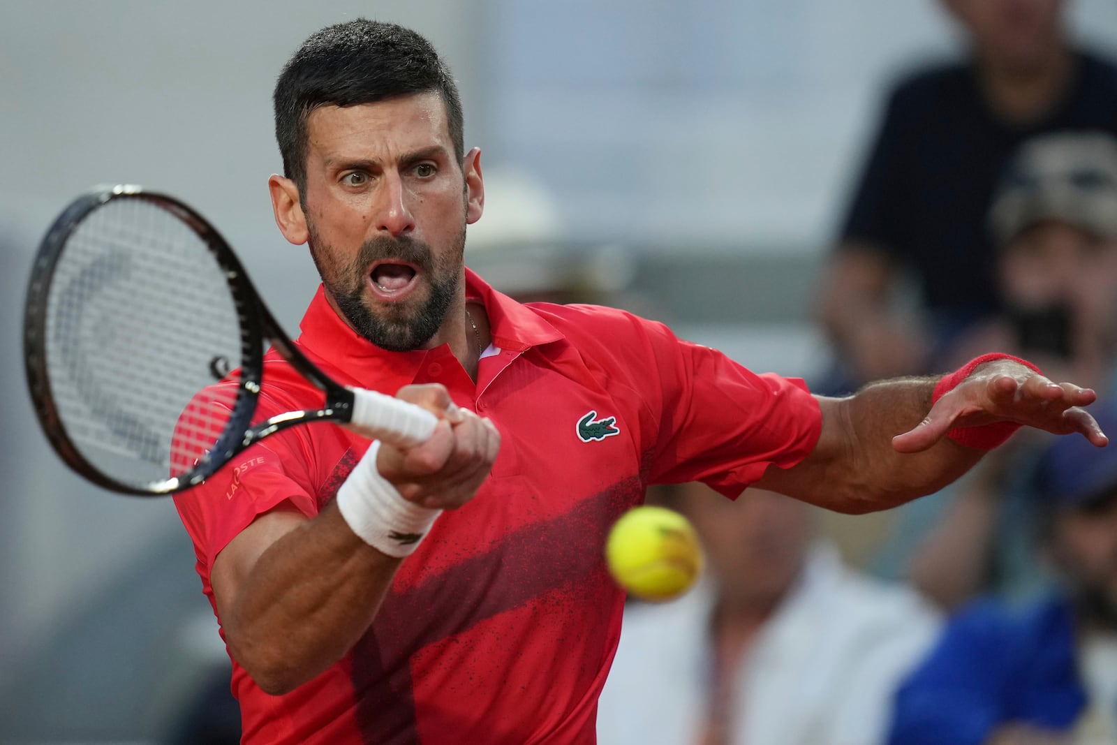 Serbia's Novak Djokovic returns the ball to France's Corentin Moutet during their second round match of the French Tennis Open, at the Roland-Garros stadium, in Paris, Thursday, May 29, 2025. (AP Photo/Christophe Ena)