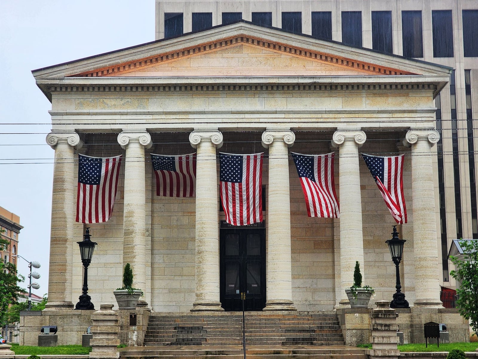 Flags are hanging from Montgomery County's Old Court House for NATO event in downtown Dayton Tuesday, May 20, 2025. NICK GRAHAM/STAFF