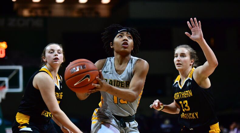 Wright State’s Angel Baker splits two NKU defenders during Thursday night’s game at the Nutter Center. WSU Athletics photos