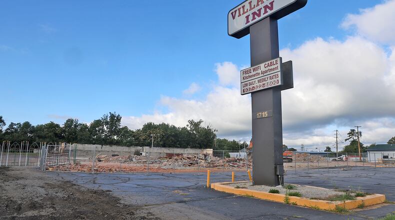 The only thing left of the former Villager Inn hotel is the sign and back wall Tuesday, August 29, 2023. The city spent $1.7 million on the property with a plan to turn it into housing for people experiencing homelessness, but problems developed almost from the time of purchase. BILL LACKEY/STAFF
