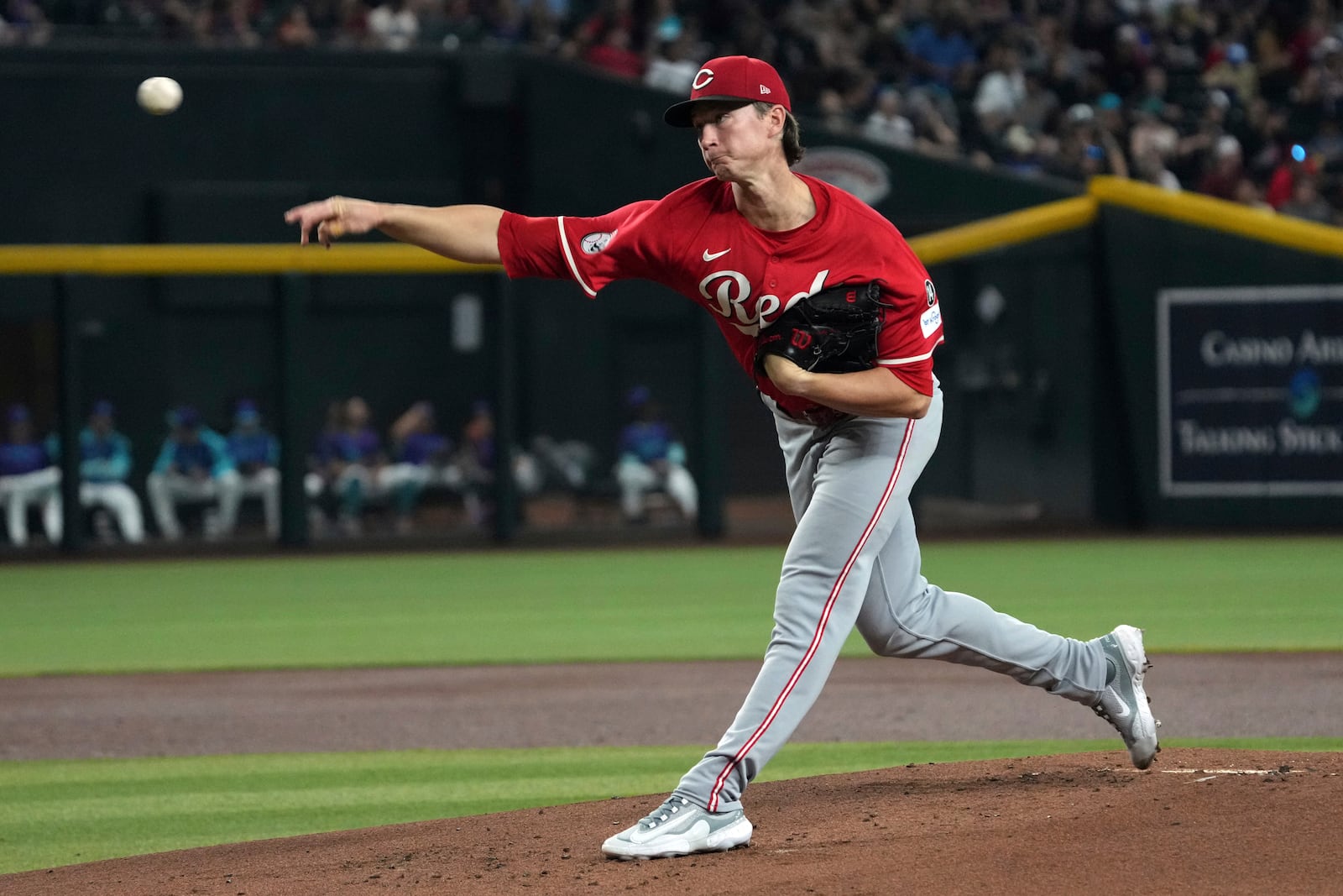 Cincinnati Reds pitcher Brady Singer throws against the Cincinnati Reds in the first inning of a baseball game, Sunday, Aug 24, 2025, in Phoenix. (AP Photo/Rick Scuteri)