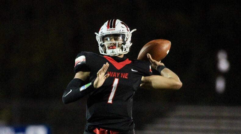Wayne's Cam Fancher throws a pass against Centerville on Friday, Oct. 9, 2020, in Huber Heights. David Jablonski/Staff