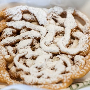 The Dayton Dragons displayed food offerings available to fans at Day-Air Ballpark this spring, including funnel cake. BRYANT BILLING / STAFF