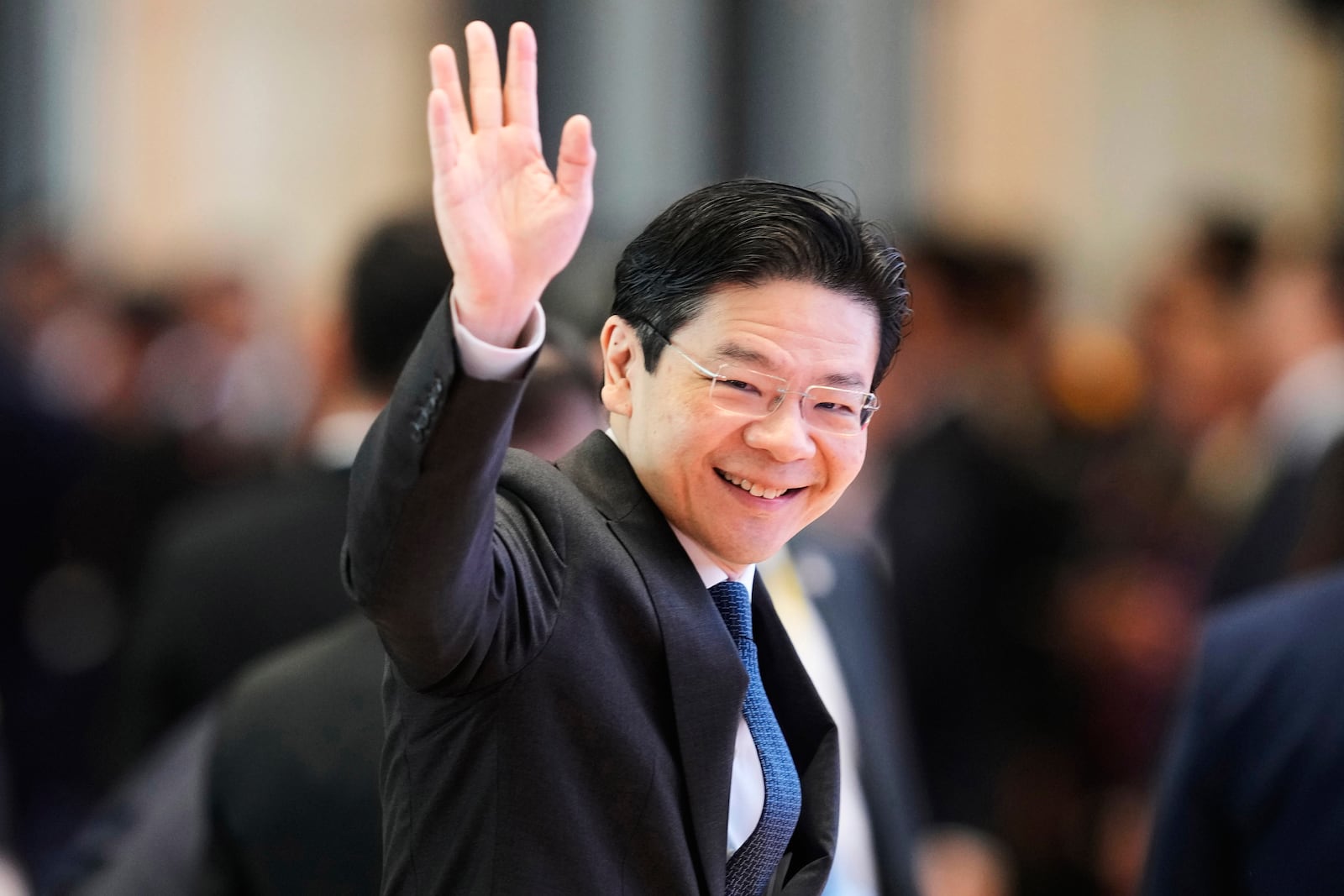 FILE - Singapore's Prime Minister Lawrence Wong arrives to participate in ASEAN-China summit in Vientiane, Laos, on Oct. 10, 2024. (AP Photo/Sakchai Lalit, File)