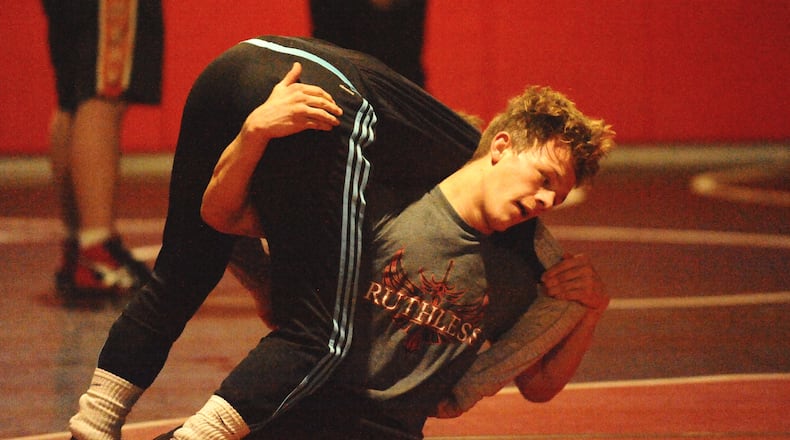 Tecumseh junior Cyle Wells (right) won the 138-pound title at the Clark County Clash on Saturday, one of five individual champions for the Arrows. Tecumseh won the team title for the third straight season. Greg Billing / Contributed