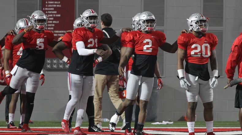 Ohio State players (left to right) Johnnie Dixon, Parris Campbell, Dontre Wilson and Mike Weber stretch before spring football practice on Tuesday, March 29, 2016, at the Woody Hayes Athletic Center in Columbus. David Jablonski/Staff