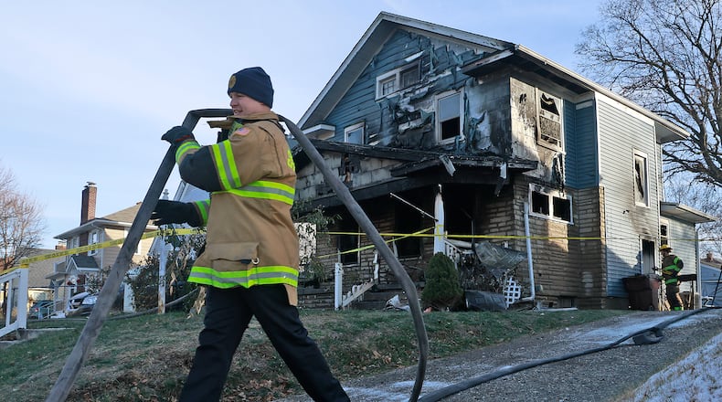 Two people were killed in a house fire early Saturday, Dec. 14, 2024. The Springfield Fire & Rescue Division arrived to find the front of the house fully engulfed in flames. As the firefighters tried to make entry into the house, one of the firefighters legs went through the floor so they had to attack the fire from the outside. BILL LACKEY/STAFF