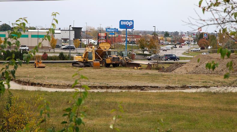 The site of a new car wash and a hotel at the intersection of North Bechtle Avenue and the St. Paris Pike Connector Thursday, Oct. 19, 2023. BILL LACKEY/STAFF