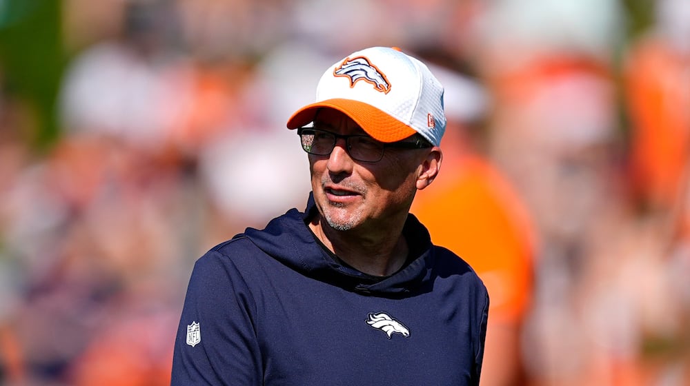 FILE - Denver Broncos senior offensive assistant Pete Carmichael looks on at an NFL football training camp Friday, Aug. 2, 2024, at the team's headquarters in Centennial, Colo. (AP Photo/David Zalubowski, File)