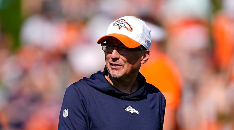 FILE - Denver Broncos senior offensive assistant Pete Carmichael looks on at an NFL football training camp Friday, Aug. 2, 2024, at the team's headquarters in Centennial, Colo. (AP Photo/David Zalubowski, File)