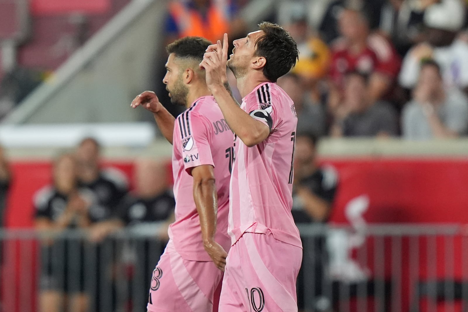 Inter Miami's Lionel Messi, right, gestures after scoring a goal as Jordi Alba walks away during the second half of an MLS soccer match against the New York Red Bulls Saturday, July 19, 2025, in Harrison, N.J. (AP Photo/Frank Franklin II)