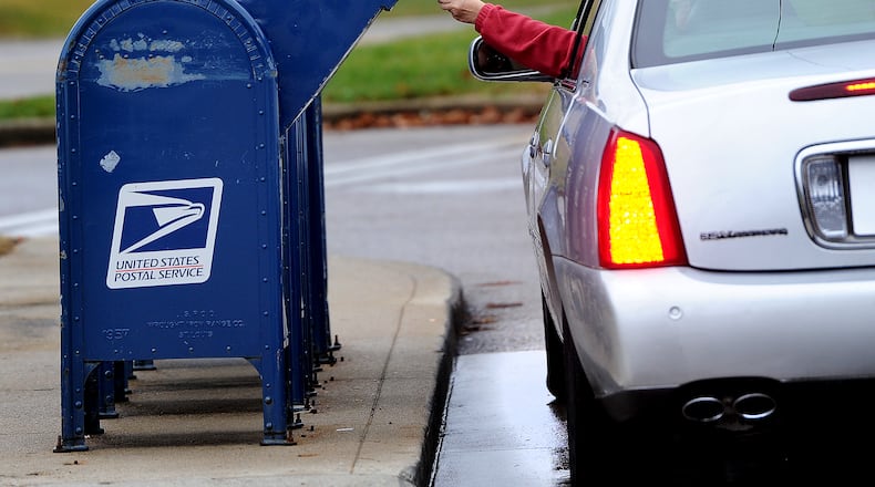 The Beavercreek Police Department warned residents against using the blue mailboxes outdoors when mailing items such as cash or checks after receiving reports of thefts from the collections boxes outside U.S. Post Offices. MARSHALL GORBY\STAFF