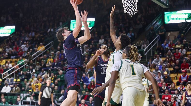 Dayton's Isaac Jack shoots against George Mason on Wednesday, Feb. 21, 2024, at EagleBank Arena in Fairfax, Va. David Jablonski/Staff