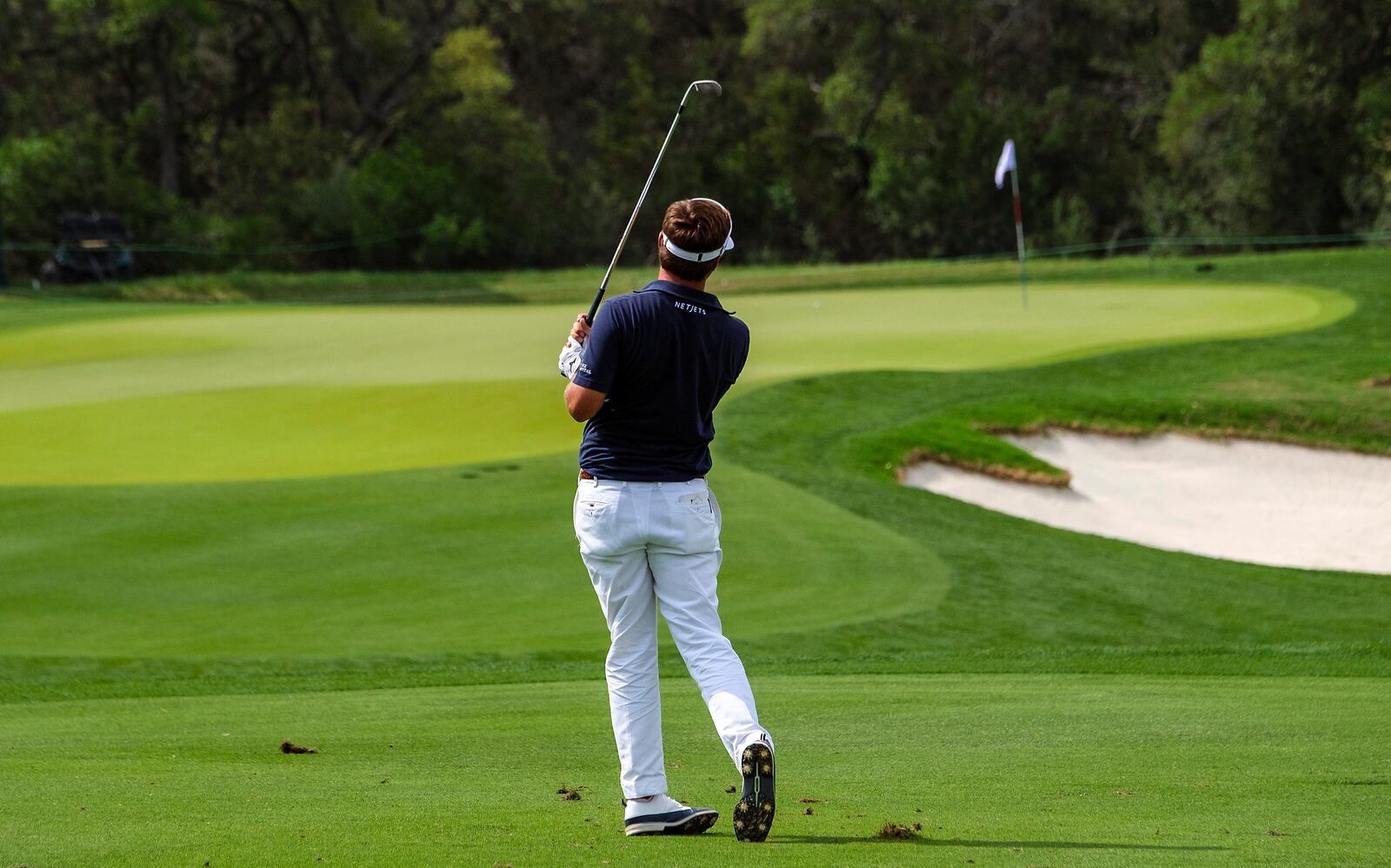 Keith Mitchell watches his approach shot to the 11th green during the first round of the Texas Open golf tournament, Thursday, April 3, 2025, in San Antonio, Texas. (AP Photos/Rodolfo Gonzalez)