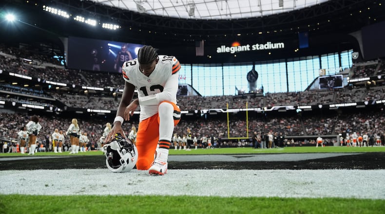 Cleveland Browns quarterback Shedeur Sanders (12) kneels in the end zone before an NFL football game against the Las Vegas Raiders, Sunday, Nov. 23, 2025, in Las Vegas. (AP Photo/Candice Ward)