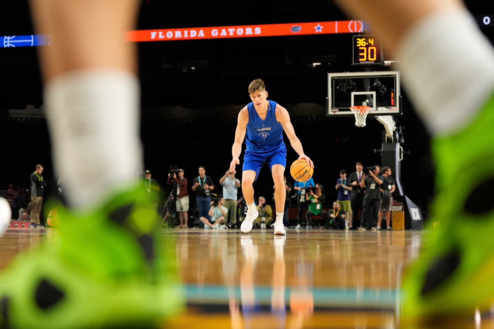 Florida forward Alex Condon warms up during practice at the Final Four of the NCAA college basketball tournament, Friday, April 4, 2025, in San Antonio. (AP Photo/Stephanie Scarbrough)
