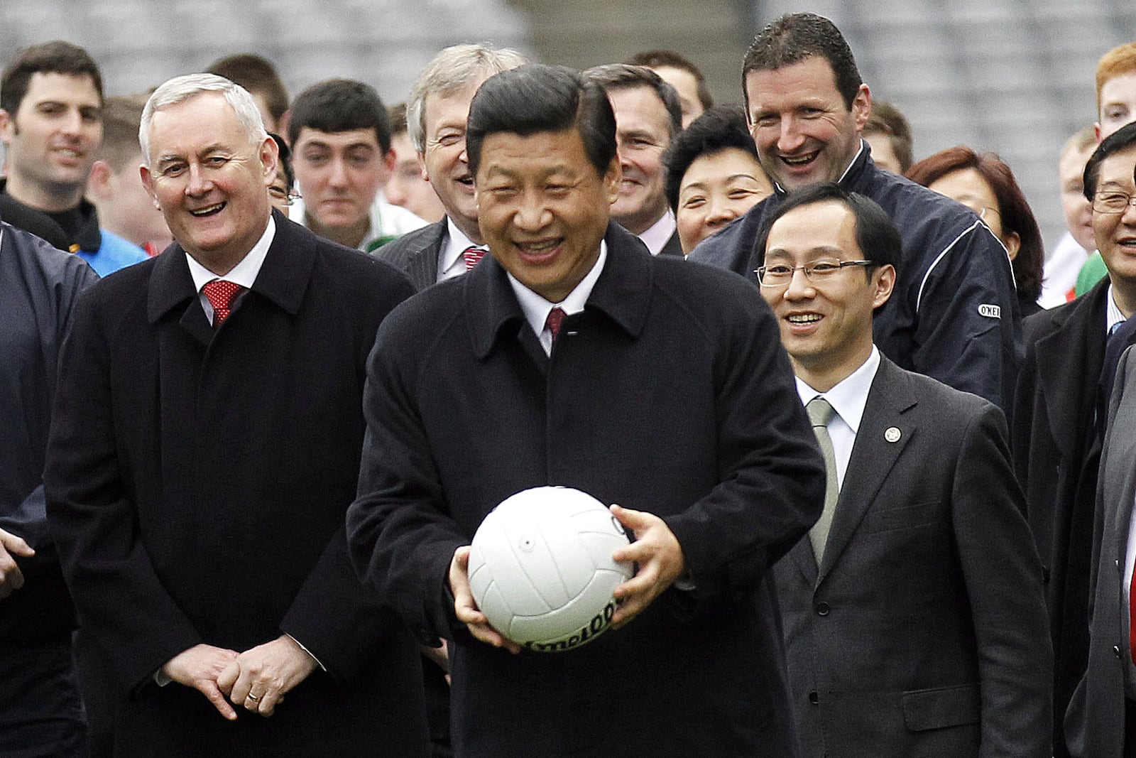 FILE - Then Vice President Xi Jinping of the People's Republic of China prepares to kick a Gaelic football during a visit to Croke Park Stadium, Ireland, on Feb. 19, 2012. (AP Photo/Peter Morrison, File)