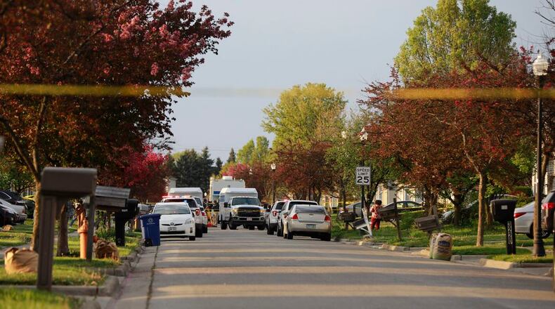 Police work on the scene Tuesday, April 20, 2021, on the east side of Columbus. Police shot and killed a teenage girl, according to newspaper reports. Officers had responded to an attempted stabbing call when police shot the girl. (Brooke LaValley/Columbus Dispatch via AP)