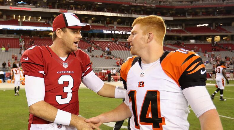GLENDALE, AZ - AUGUST 24: Quarterback Carson Palmer #3 of the Arizona Cardinals talks with quarterback Andy Dalton #14 of the Cincinnati Bengals following the preseason NFL game at the University of Phoenix Stadium on August 24, 2014 in Glendale, Arizona. (Photo by Christian Petersen/Getty Images)