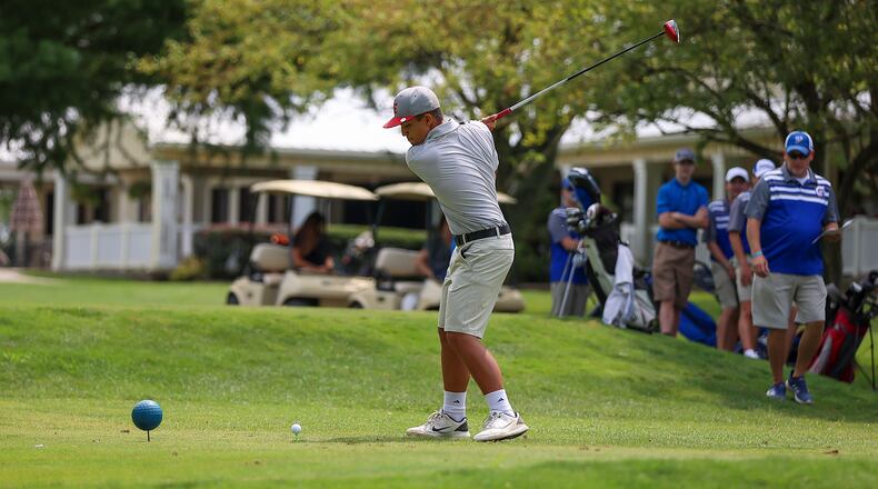 Southeastern High School junior Kason Spears tees off during their match against Greeneview and Shekinah Christian on Tuesday afternoon at Locust Hills Golf Club. The Trojans are seeking a return trip to the Division III district tournament. CONTRIBUTED PHOTO BY MICHAEL COOPER