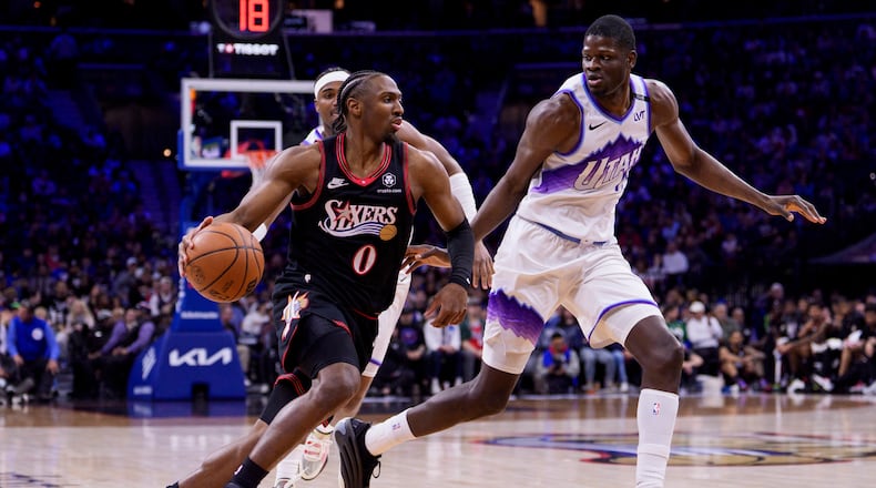 Philadelphia 76ers' Tyrese Maxey, left, drives to the basket against Utah Jazz's Mo Bamba, right, during the first half of an NBA basketball game, Wednesday, March 4, 2026, in Philadelphia. (AP Photo/Chris Szagola)