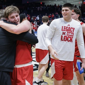 Miami University senior guard Peter Suder (left) following an 89-79 win over Southern Methodist in an NCAA First Four game on Wednesday, March 18 at University of Dayton Arena. BRYANT BILLING / STAFF