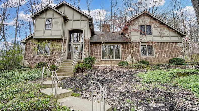 The 2-story home has 3 bedrooms and about 3,130 sq. ft. of living space, including a partially finished basement with flex rooms. The home is on a 1.06-acre lot, and an asphalt driveway winding through the woods to the side-entry, 3-car garage. CONTRIBUTED PHOTO