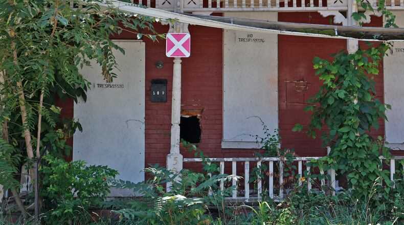 An abandoned house in Springfield Tuesday, August 8, 2023. BILL LACKEY/STAFF