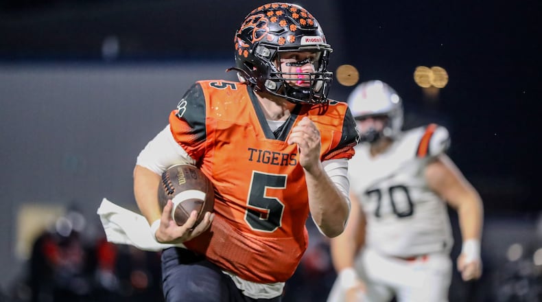West Liberty-Salem quarterback Nick Shifflet, shown here last week vs. Waynesville, rushed for two touchdowns and passed for another in Friday's win over Indian Lake in the Division V, Region 20 final. Michael Cooper/CONTRIBUTED