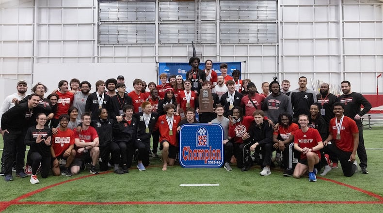 Wttenberg poses with the NCAC indoor track championship trophy on Saturday, Feb. 28, 2026, at The Steemer in Springfield. Photo by Pam Klopfer