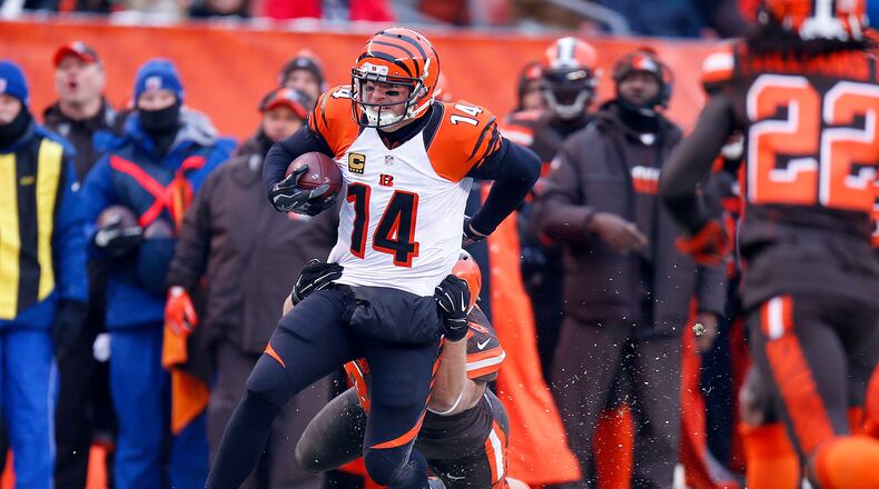 Bengals quarterback Andy Dalton has been known to run the ball now and then, as he did here against the Browns last December 18 in Cleveland, but not like in this video game situation. No, definitely not like that.
