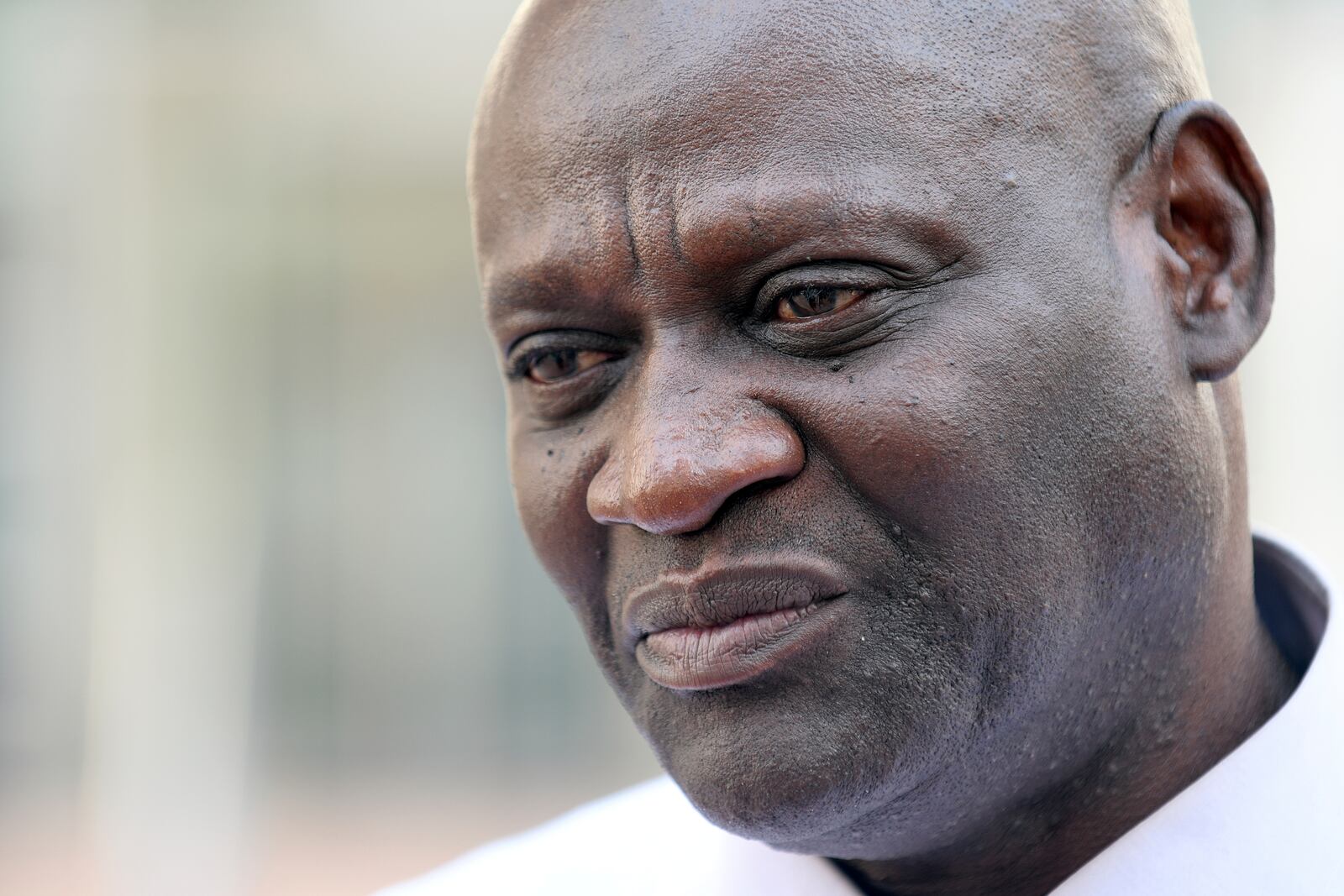 Demba Dem, a former member of the Gambian parliament who was tortured by former Gambian military member Michael Sang Correa, stands outside federal court following Correa's conviction in Denver on Tuesday, April 15, 2025. (AP Photo/Thomas Peipert)