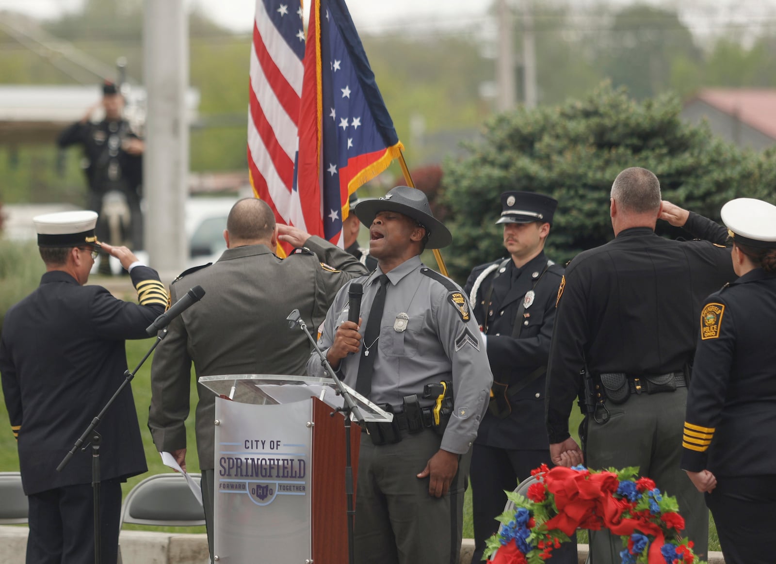 Ohio State Highway Patrol Trooper Jerome Thomas sings the National Anthem at the beginning of Public Safety Forces Day on Friday, May 2, 2025, near the Clark County Public Safety Memorial. JOSEPH COOKE/STAFF