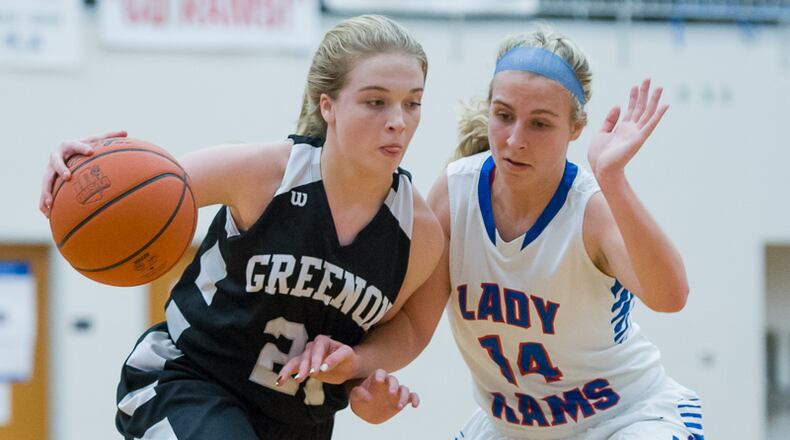 Greenon’s Lydia Henry (left) tries to dribble past Greeneview’s Hannah Ferrell during a game in 2017. Henry and teammate Regan Ware (not pictured) will be the top returnees for new Greenon girls basketball coach Lonnie Robinson. FILE PHOTO