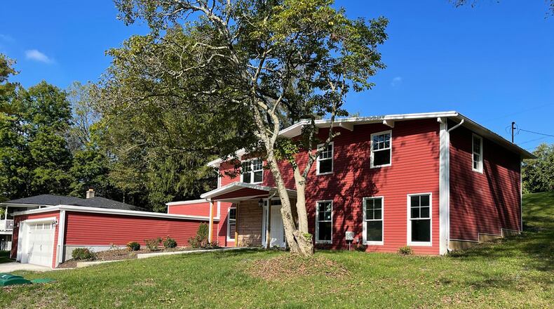 The 2-story offers 2,620 sq. ft. of living space with 4 bedrooms. The home has been totally remodeled with many new amenities, such as flooring, kitchen appliances and bath fixtures. A concrete drive leads to a 2-car attached garage and covered front porch with stone surround and professional landscaping. CONTRIBUTED PHOTO