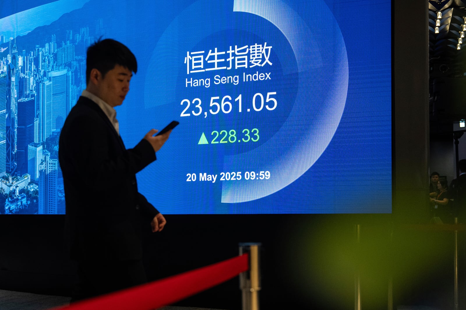 Hang Seng Index is displayed on the digital screen at the listing ceremony of Contemporary Amperex Technology Co. (CATL) in Hong Kong, Tuesday, May 20, 2025. (AP Photo/Chan Long Hei)