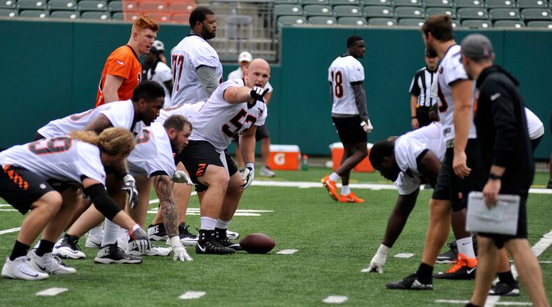 Cincinnati Bengals rookie center Billy Price makes a line call during Tuesday’s first day of mandatory minicamp at Paul Brown Stadium. JAY MORRISON/STAFF